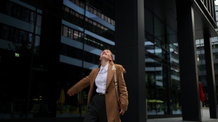 Confident Businesswoman Embraces Freedom On City Streets