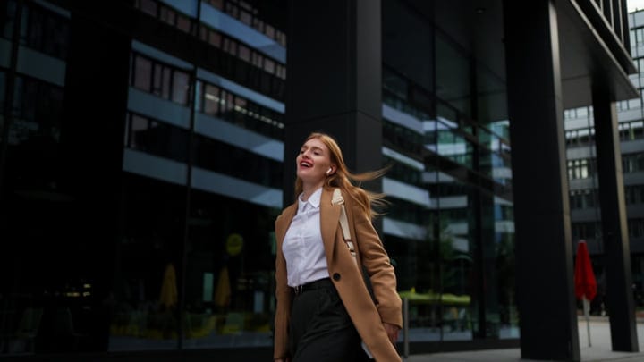 Confident Businesswoman Strolling Through Vienna's Urban Landscape