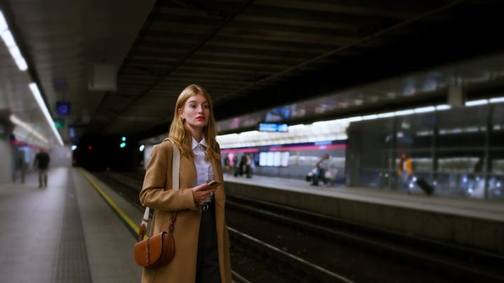 Composed Businesswoman Awaits Train at Vienna Station