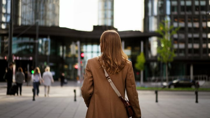 A Businesswoman Strolls Through Vienna's Urban Landscape