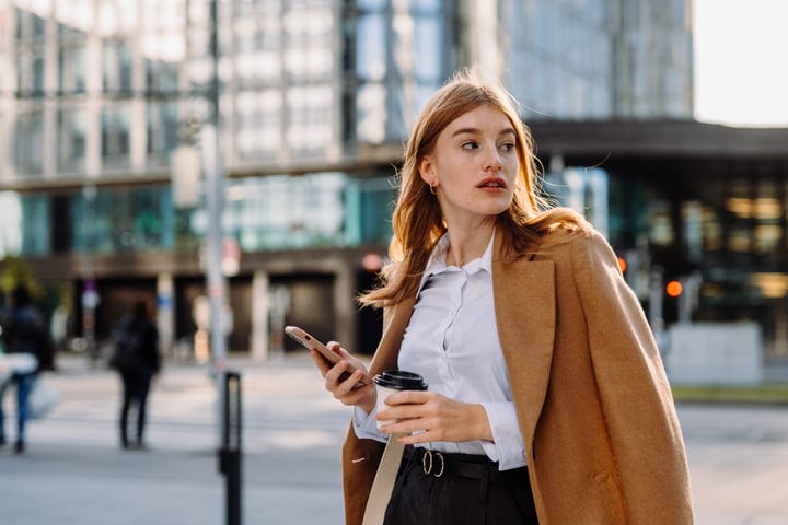 Confident Businesswoman Navigates Vienna Streets With Purpose