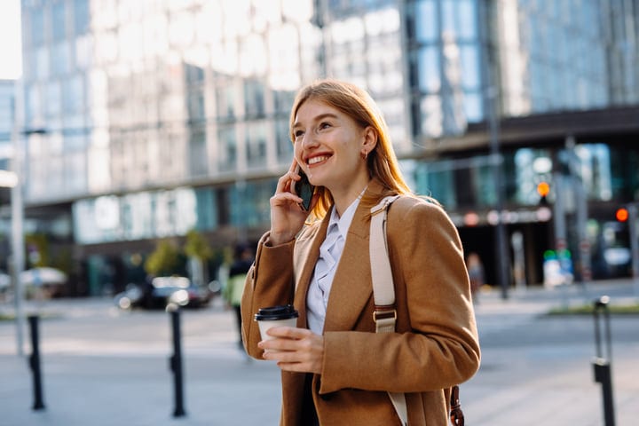 Confident Businesswoman Chats On Phone In Vienna Cafe Scene