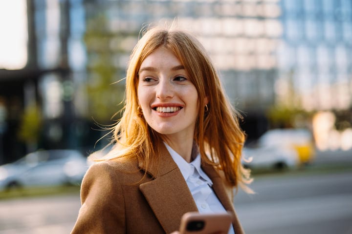 Confident Businesswoman Embraces Autumn in Vienna Streets