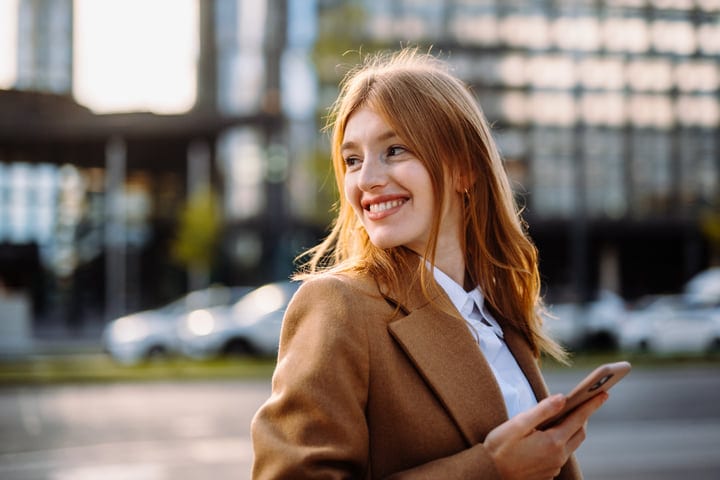 Businesswoman Smiling in the Heart of Vienna's Autumn Light