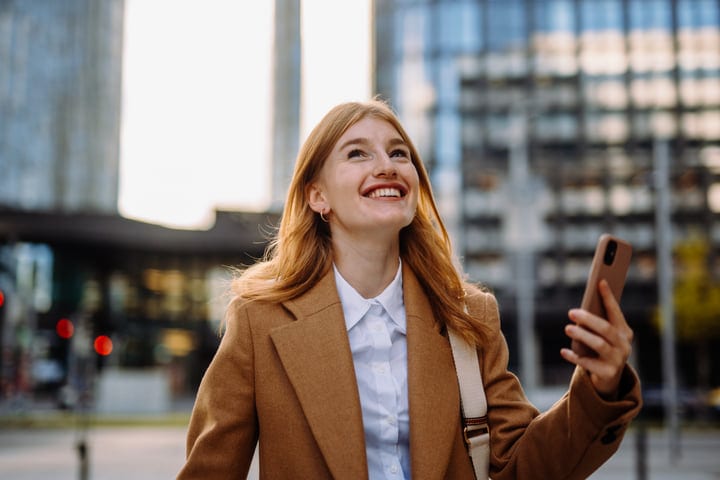 Confident Businesswoman Smiling With Phone in Vienna's Heart