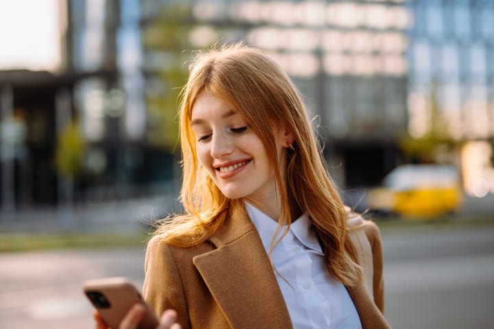 Businesswoman Enjoys Morning Sunlight In Vienna Street