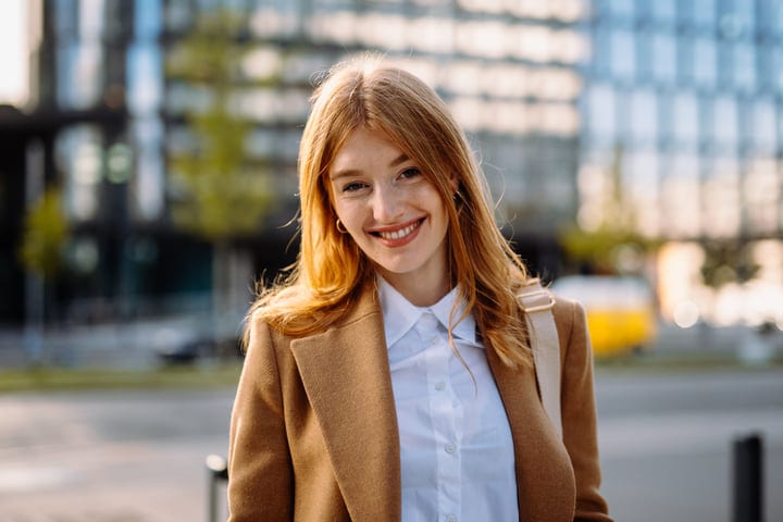Confident Businesswoman Smiling Outside A Vienna Cafe