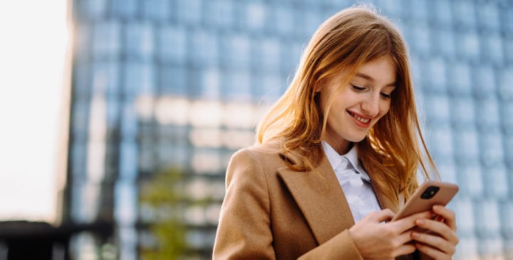 Businesswoman Enjoys A Sunny Day In Vienna With Her Phone