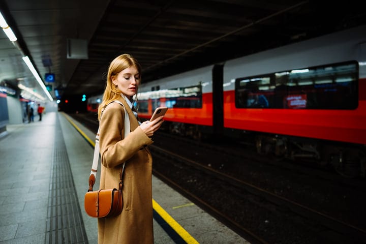 Composed Businesswoman Awaits Train On A Vienna Platform