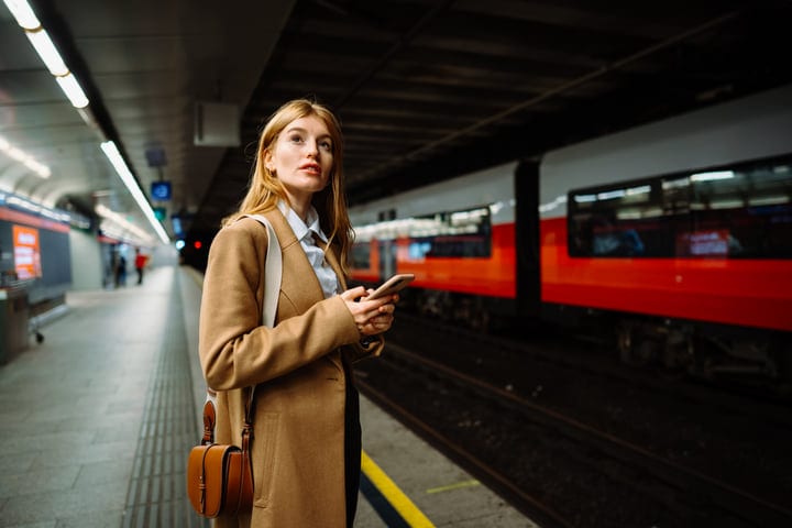 Contemplative Pause in Vienna's Bustling Subway Station