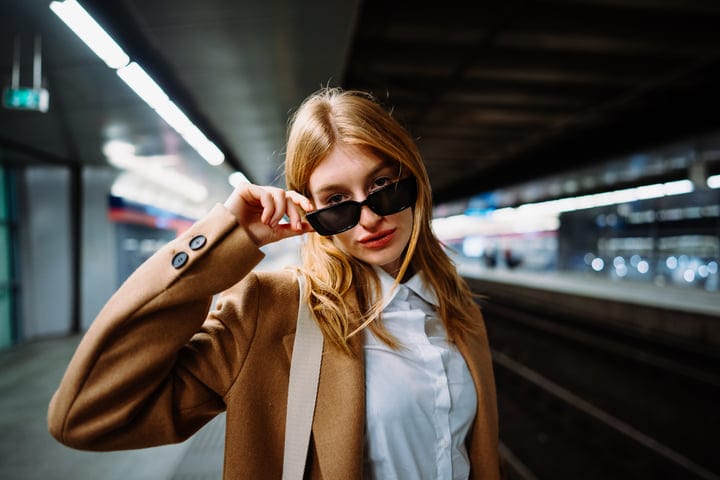 Confident Businesswoman Adjusts Sunglasses In Vienna Station