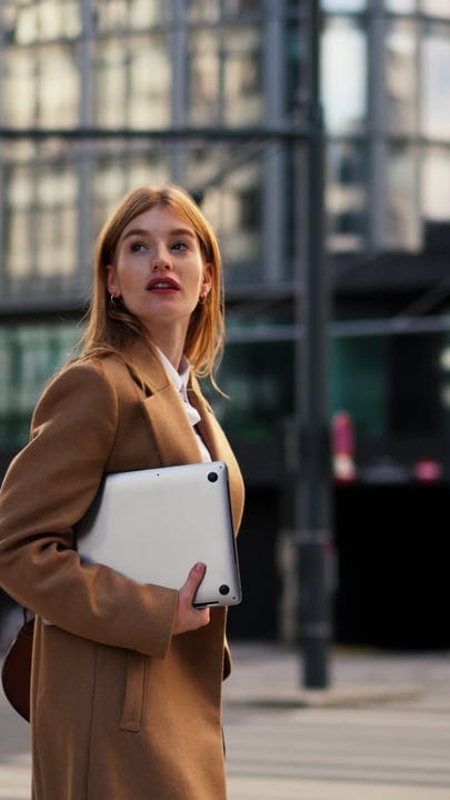 Confident Businesswoman Navigates Vienna's Urban Landscape