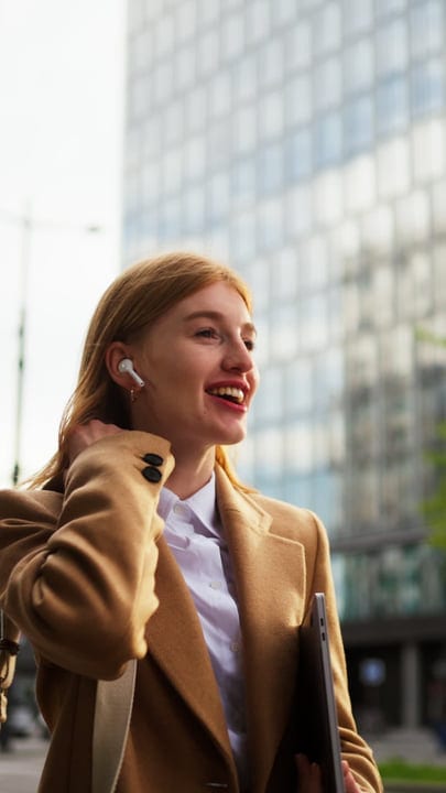 Businesswoman Enjoys a Sunny Day in Vienna's Urban Scene