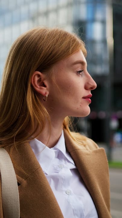 Contemplative Businesswoman Gazing Out Across Vienna's Cityscape