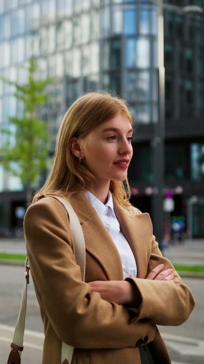 Contemplative Businesswoman Outside Modern Vienna Cafe Setting