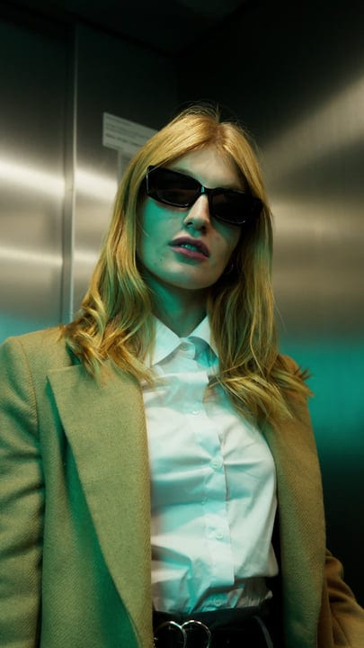Confident Businesswoman Embraces Urban Elegance In Vienna Elevator