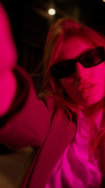 Dynamic Businesswoman in Pink Light at Vienna Cafe