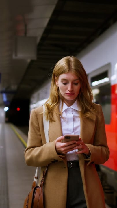 Focused Businesswoman Navigating Vienna's Metro With Ease