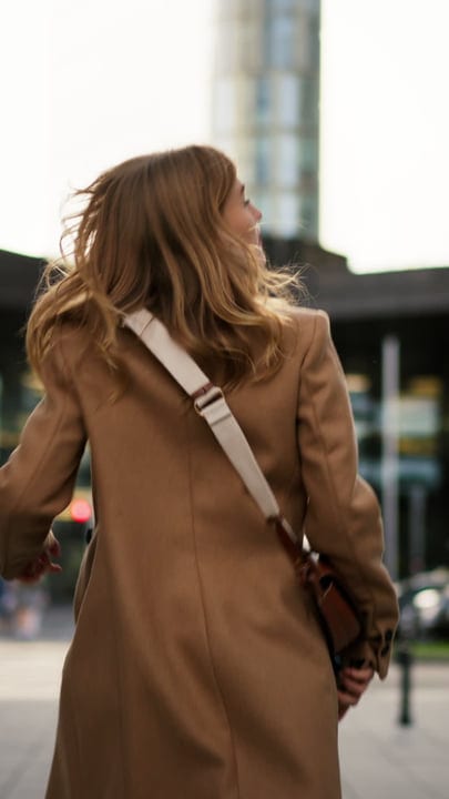 Businesswoman Walking Confidently Through Vienna Streets