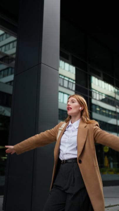 Joyful Businesswoman Embraces Freedom In Urban Vienna