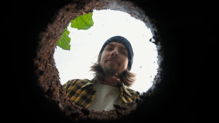 Curious Gardener Peering Into Freshly Dug Earth