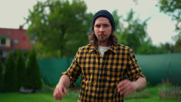 Gardener In Beanie Preparing For Lawn Mowing Task
