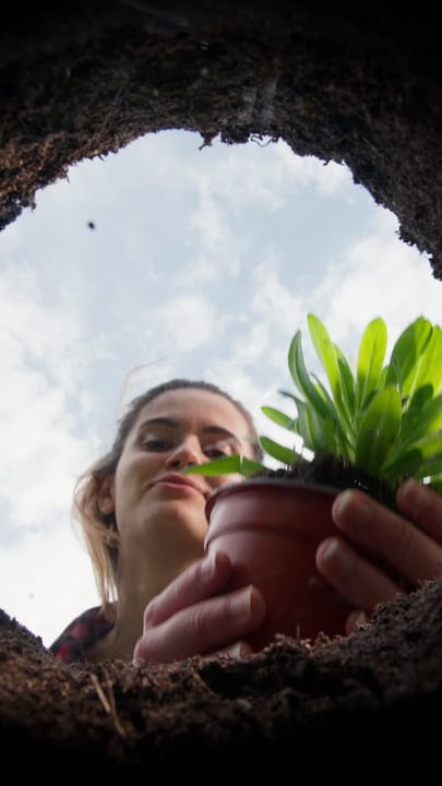 A Gardener Prepares To Plant Under Clear Skies