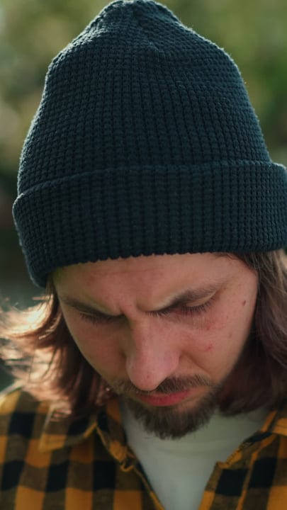 A Gardener's Quiet Focus Under The Warm Sun