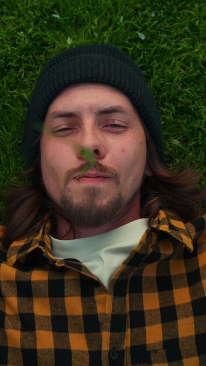 Relaxed Gardener Enjoying A Break On Freshly Mowed Lawn