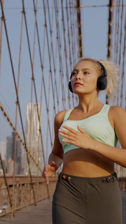 Urban Runner Embraces City Freedom On Iconic Bridge
