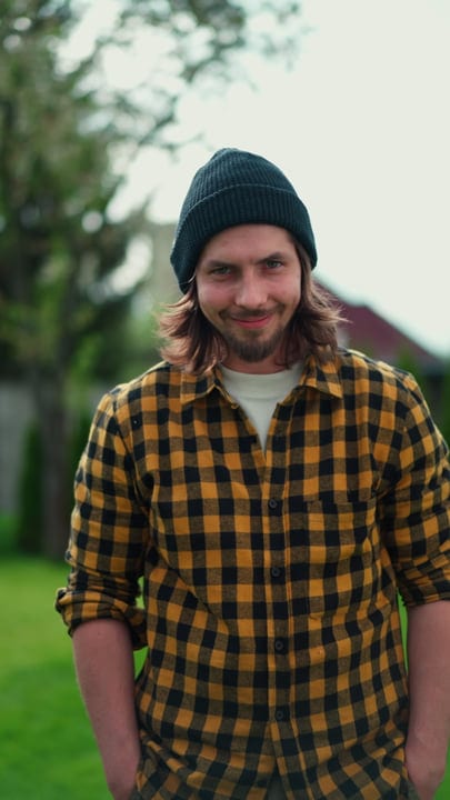 Young Gardener in Plaid Shirt Enjoys a Day Outdoors