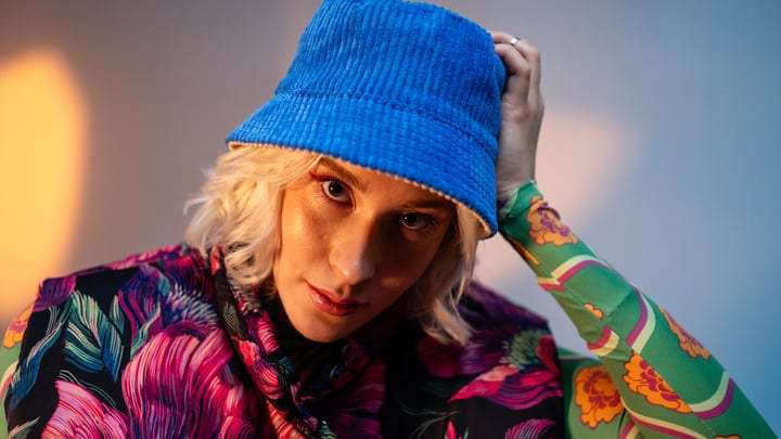 Vibrant Gen Z Style in Bold Floral and Blue Hat