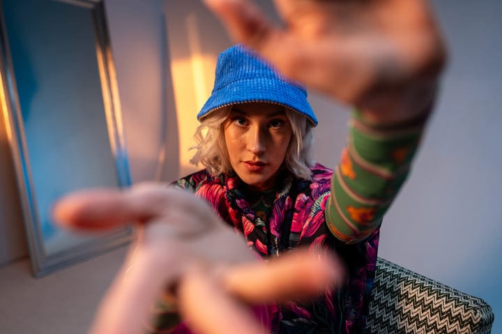 Vibrant Gen Z Portrait With Playful Hand Gestures