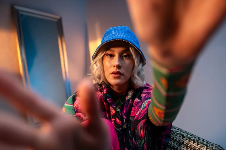 Expressive Gen Z Pose With Vibrant Style In Studio