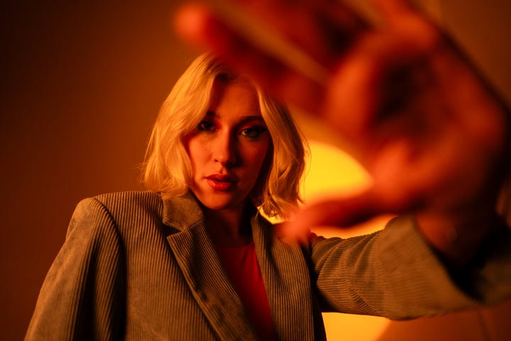 Blonde Gen Z Captivates With Autumnal Studio Glow