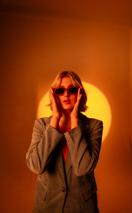 Gen Z Individual Embracing Bold Style In Studio Portrait