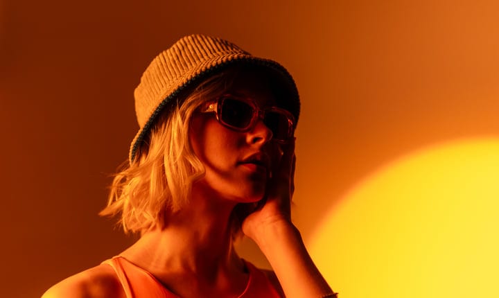 Youthful Glow With Sunglasses In Sunset Hues