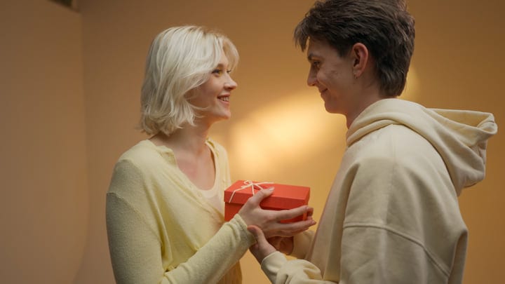 Young Couple Shares a Moment With a Gift Exchange