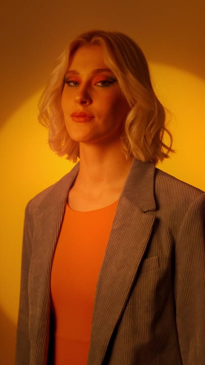 Confident Gen Z Individual in Bold Studio Lighting