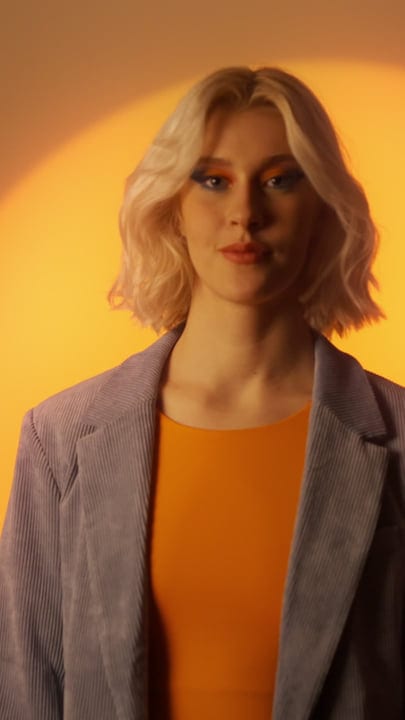 Bold Fashion Statement In Vibrant Orange Studio Lighting