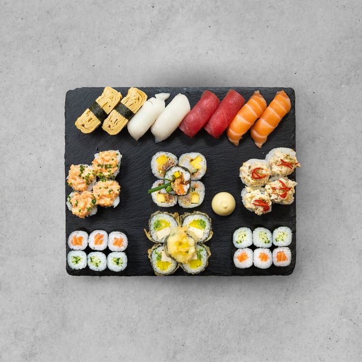 An Array Of Sushi Delights On A Slate Platter