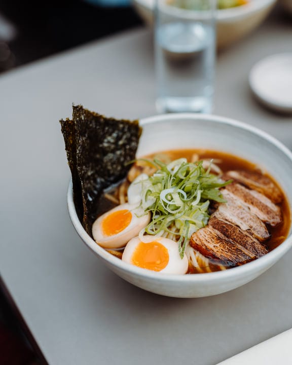 Steaming Bowl Of Ramen With Vibrant Toppings
