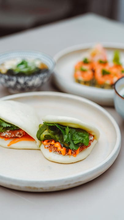 Savoring Bao Buns With Fresh Herbs And Vegetables