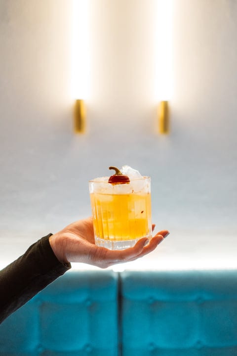 An Elegant Hand Presents A Seasonal Cocktail Delight