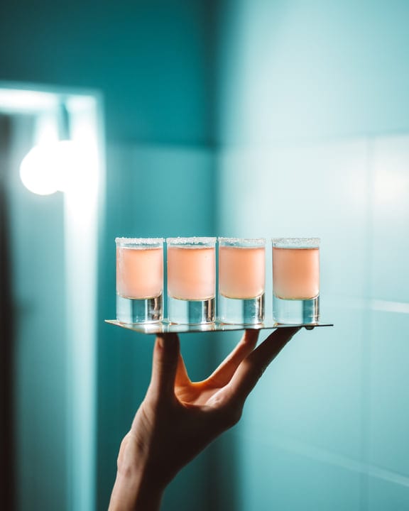 Elegantly Balanced Shots on a Sleek Metallic Tray