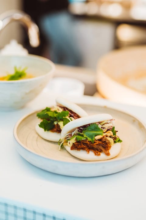 Savoring Seasonal Bao Buns With Fresh Cilantro Garnish