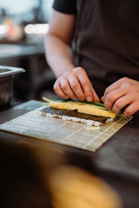 Crafting Sushi Rolls With Precision and Careful Hands