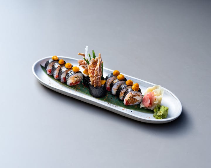 Elegant Sushi Roll Arrangement With Gourmet Presentation