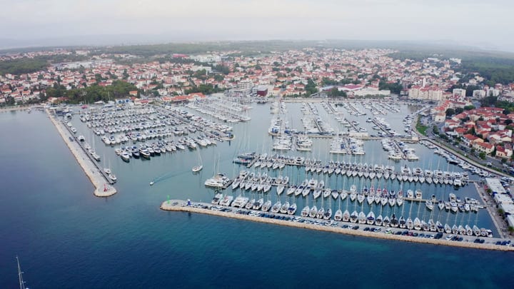 Aerial View Of A Bustling European Marina At Dusk