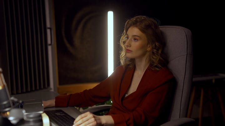 Focused Producer Immersed in Creative Studio Atmosphere
